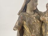 a statue of a woman holding a baby in her arms