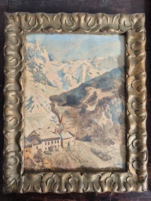 an old picture frame with a picture of a mountain scene in it