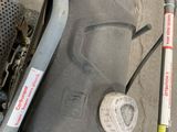 a close up of a motorcycle with a gas can on the back