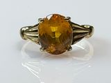 an image of a ring with a large citrine stone in it