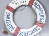 a life preserver that is hanging on the wall