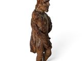 statue of a man holding a sword on a white background