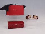 pair of sunglasses in a red case and a pair of sunglasses in a red case