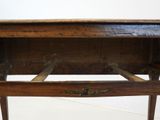 a wooden table with a drawer on top of it
