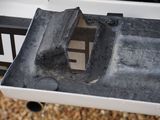 a small piece of luggage sitting on the back of a truck