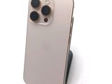 an iphone 11 pro with a camera attached to the back of it