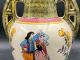 an image of a vase with a painting on it on a table