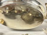 a silver plate with a flower design on it