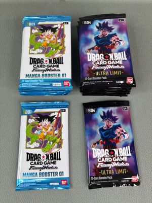 three packs of dragon ball trading cards sitting on top of a table