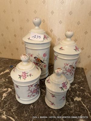 three canisters with birds on them sitting on a table