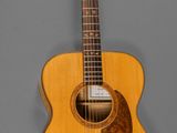 an acoustic guitar with a wooden body and strings