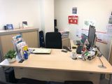 a desk with a computer and a monitor on it