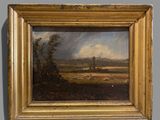 une peinture à l'huile représentant un paysage avec des moutons paissant dans un champ