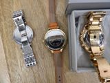 two watches in a box on a wooden table