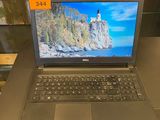 a laptop that is sitting on a table with a price tag