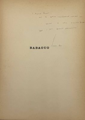 an old book with writing on it sitting on top of a table