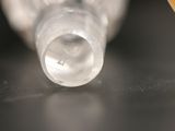 a close up of a bottle of toothpaste on a table