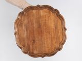 an image of a person holding a wooden tray in their hand