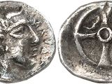 a close up of a coin with a cross on it