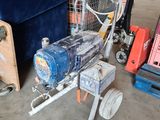 a small machine that is sitting in a garage