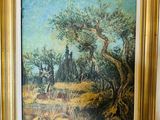 une peinture à l'huile d'un paysage avec des arbres dans un cadre doré