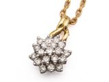 an image of a gold and diamond flower pendant on a chain