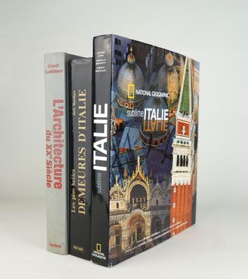 two books are stacked on top of each other on a white surface