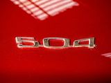 a close up of the emblem on a red car