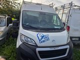 a white van that is parked in the grass
