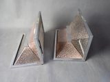 mirrored bookends in the shape of a pyramid with a silver base