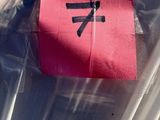 a red piece of paper that has been wrapped in plastic
