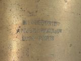a close up of a metal object with a sign on it