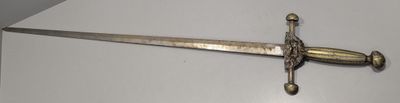 a sword that is laying on a table