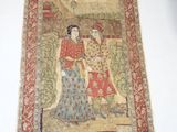 an oriental rug with a woman and a man on it