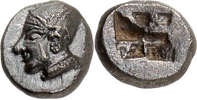 a silver coin with an image of a man on it