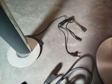 a lamp that is sitting on the floor next to some wires
