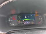 the dashboard of a car with a digital display on it