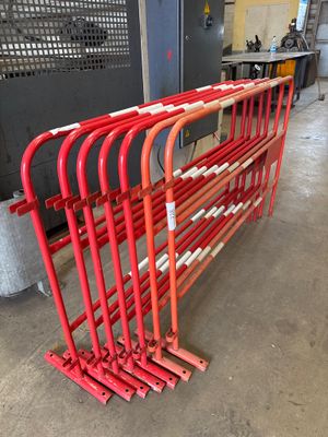 a lot of red pipes that are on the floor