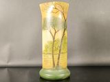 a vase that has a picture of a tree on it