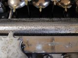 a close up view of a machine that has a bunch of spoons on it