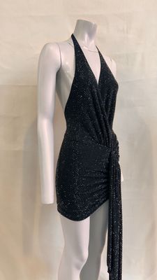 the mannequin is wearing a black dress with a tie around the waist
