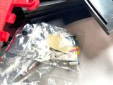 a bag of mail sitting on a table next to a toy gun