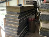a pile of wood stacked on top of each other in a building