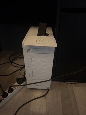 a white box with a phone on top of it on the floor