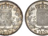 a silver coin with a crown on top of it