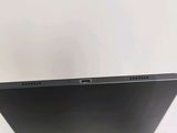 an apple laptop computer sitting on top of a white table