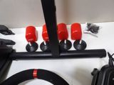 a lot of red knobs on a black pipe
