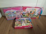 two boxes of toys sitting on a wooden floor next to each other