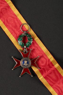 an image of a red and yellow ribbon with a star on it