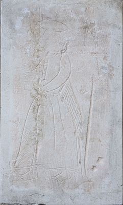 an image of a stone relief of a man and woman